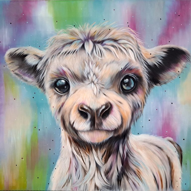 A smiling lamb portrait against a colourful, blurred background.