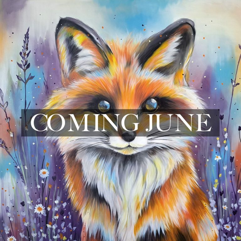 A smiling lamb portrait against a colourful, blurred background.